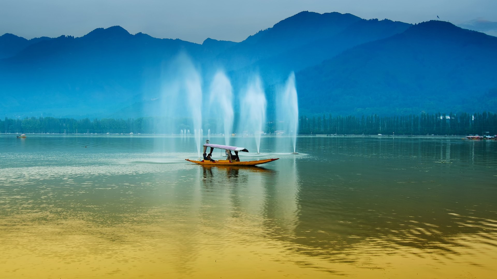 Kashmir Dal Lake shikara at sunrise