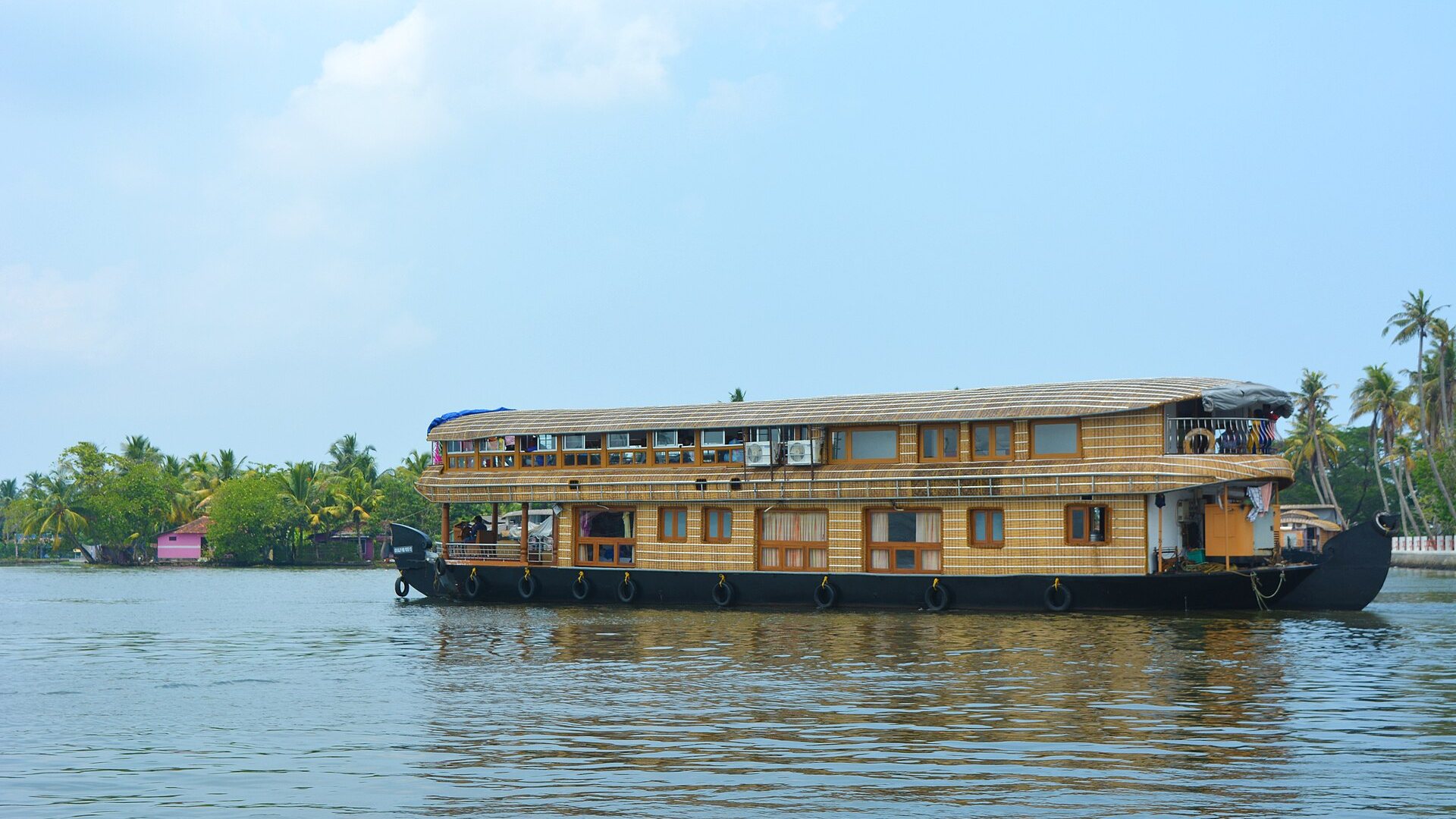 Kerala backwaters houseboat at golden hour