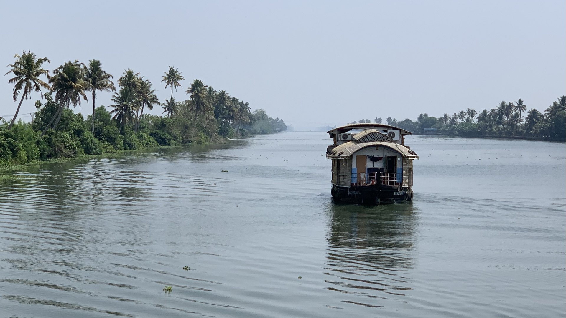 Kerala backwaters houseboat at golden hour